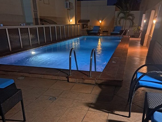 Outdoor pool lit up for the evening